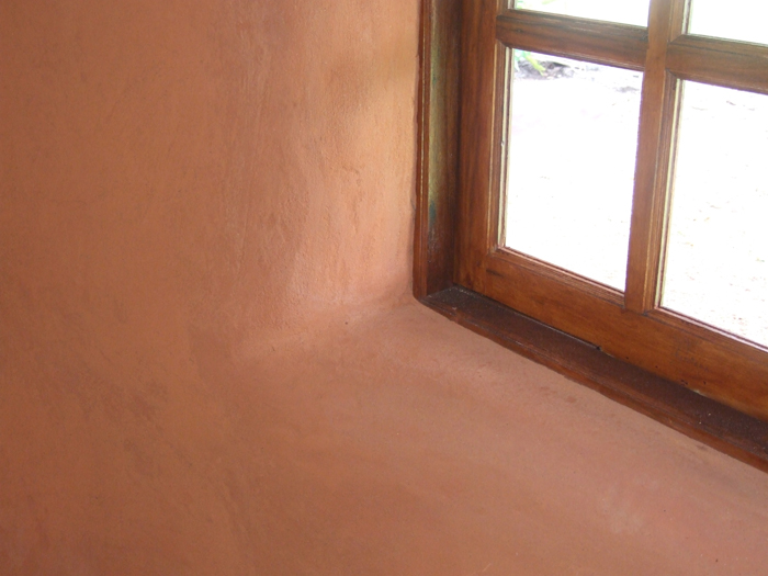 Curved Earthen Plaster around Window Openings