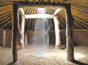 Interior view of traditional Pawnee earth lodge.