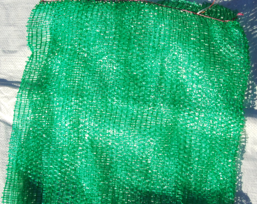 Close-up view of raschel mesh bags used for Hiperadobe.