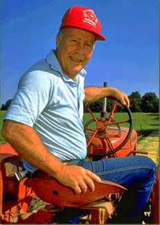 Author Gene Logsdon on his tractor