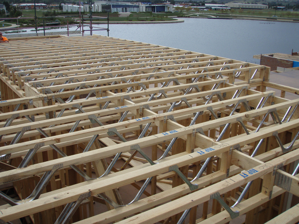 Commercially available Posi-strut parallel chord open web joists are recommended for areas with building codes.