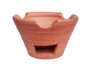Twig stove with hole for inserting tinder and kindling.