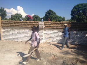 My Haitian friends are making progress -- they started filling plastic wattle tubes with rice straw and are using it for a dorm building!