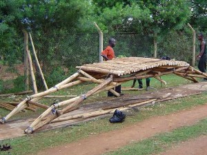 Simple, inexpensive log bridge made primarily with local resources