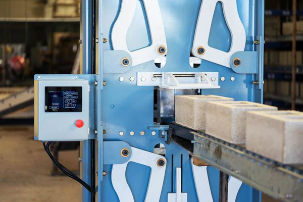 Watershed Materials’ high compression masonry block machine imparts 500,000 pounds of compressive force to produce low cement alternatives to traditional concrete masonry units (CMUs).