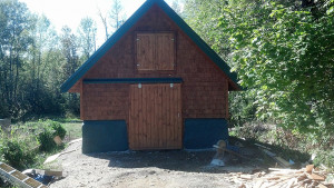 Finished barn with earthbag stem wall.