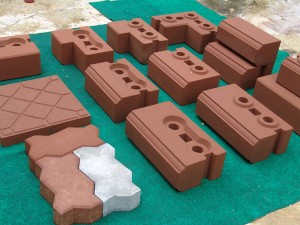 Compressed earth blocks (CEBs) come in dozens of shapes