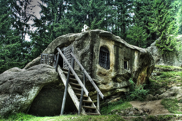 Hidden in plain sight: tiny boulder house/ survival shelter looks like a natural boulder that can be concealed by vines and fast growing plants such as bananas