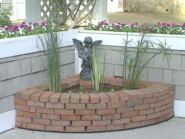 Corner water feature made of recycled brick (CEBs also work great)