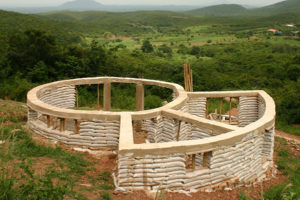 The Aseseeso earthbag chalet under construction. Note how it’s built on sloping ground.