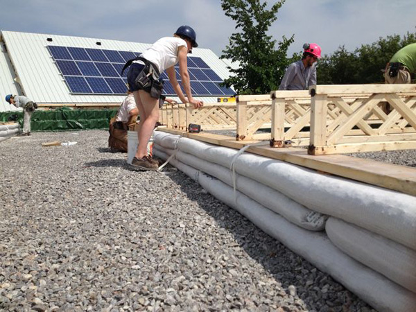 Three courses of earthbag were used to create a foundation for the floor joists