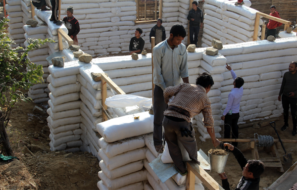 Villagers and Good Earth Nepal team building an earthbag school in Agra, Makwanpur, Nepal