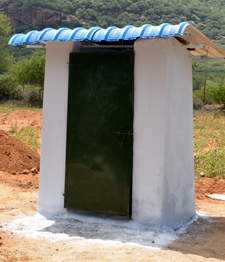 Close-up view of finished hyperadobe earthbag toilet