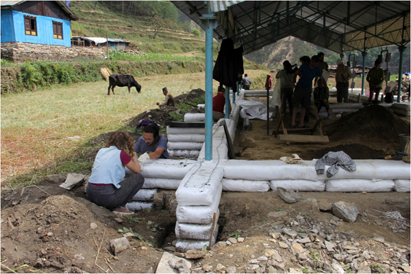 This steel framed school in Phulping, Nepal is being reconstructed with earthbag tubes wrapped around the steel posts.