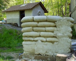 Failed plaster on unprotected earthbag wall