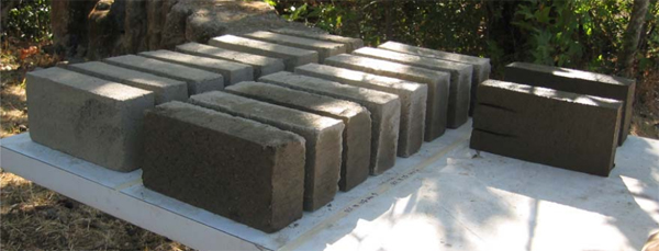 Stabilized adobe bricks (CEBs) curing in the shade