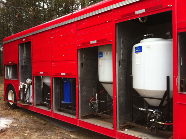 Make your own biodiesel with this mobile biodiesel processing plant made from a common beverage trailer.