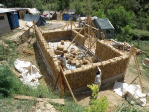 Tightly packed walls and a gravel bag (earthbag) foundation creates better weather-proofing.