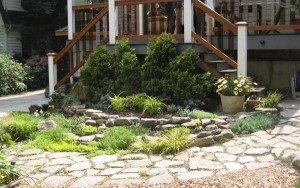 Natural looking pocket garden next to stairs