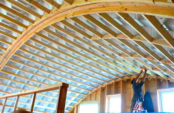 Quonset building with interior wood framing