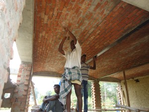 Cleaning a series of brick barrel vaults.