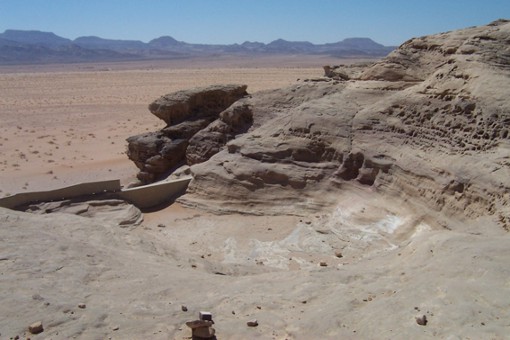 A modern cement dam has been built over the old Nabataean stone dam.