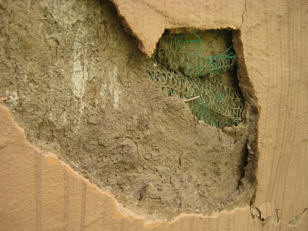 Close-up view of water damaged plaster