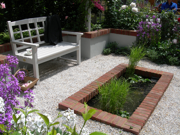 Water feature by garden bench